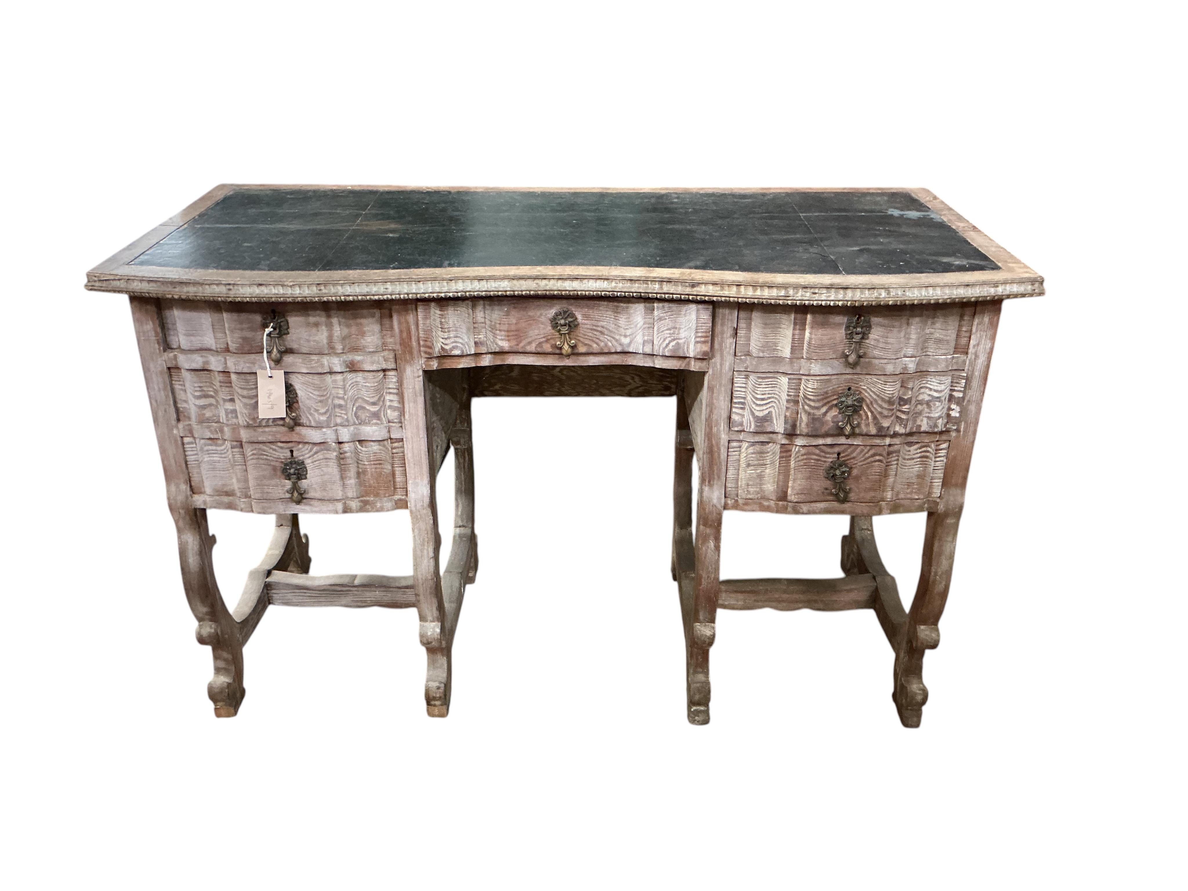 An early 20th century Continental bleached oak kneehole desk, width 122cm, depth 56cm, height 78cm